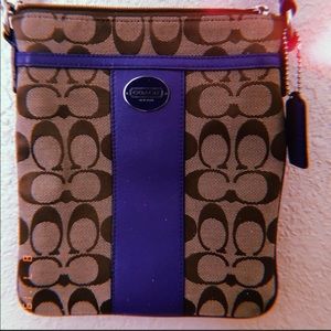crossbody Coach brown bag w/ purple lining